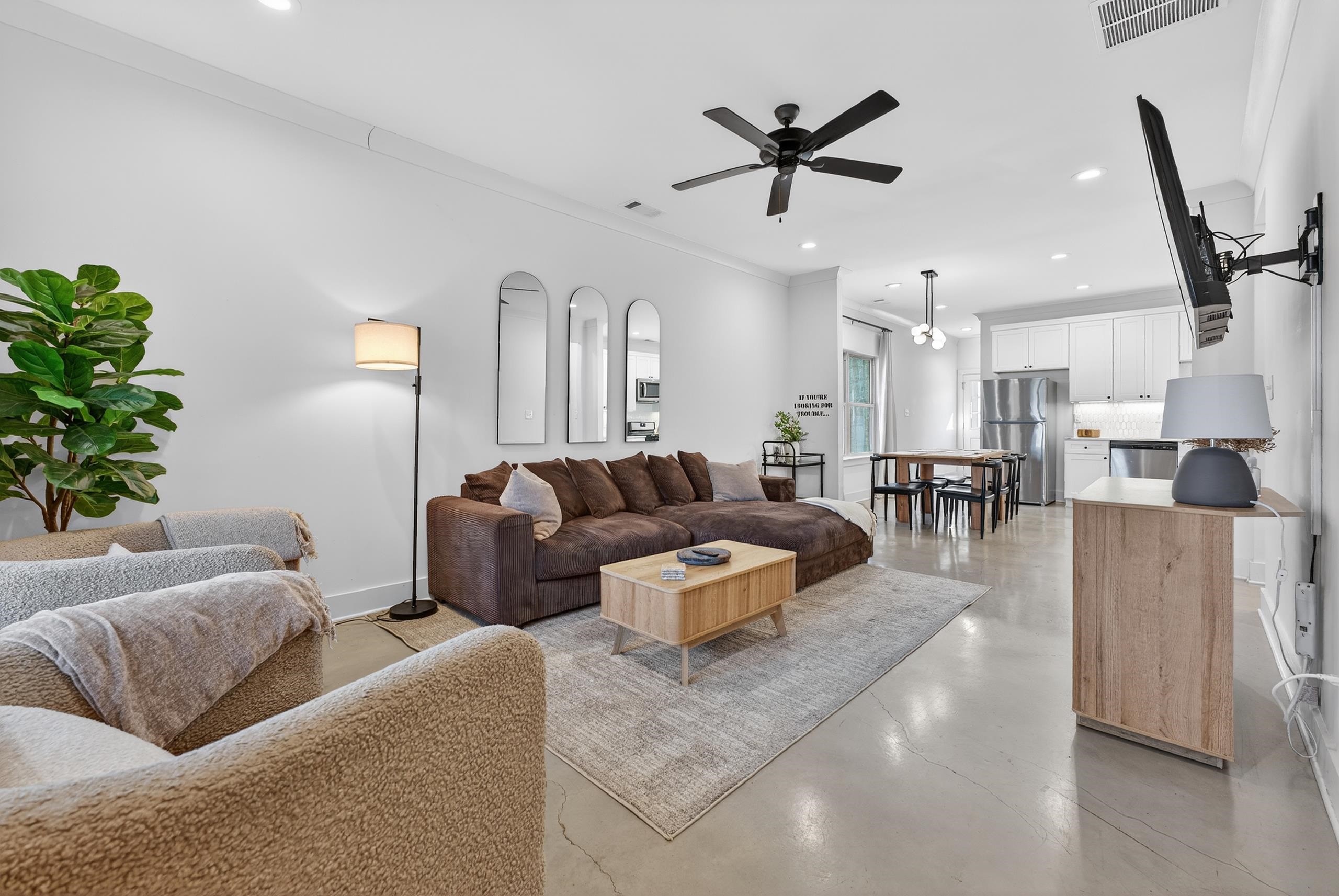 668 Hawthorne Street Memphis, TN 38107 - Photo 6 of 24 Living area featuring finished concrete floors, crown molding, recessed lighting, and a ceiling fan