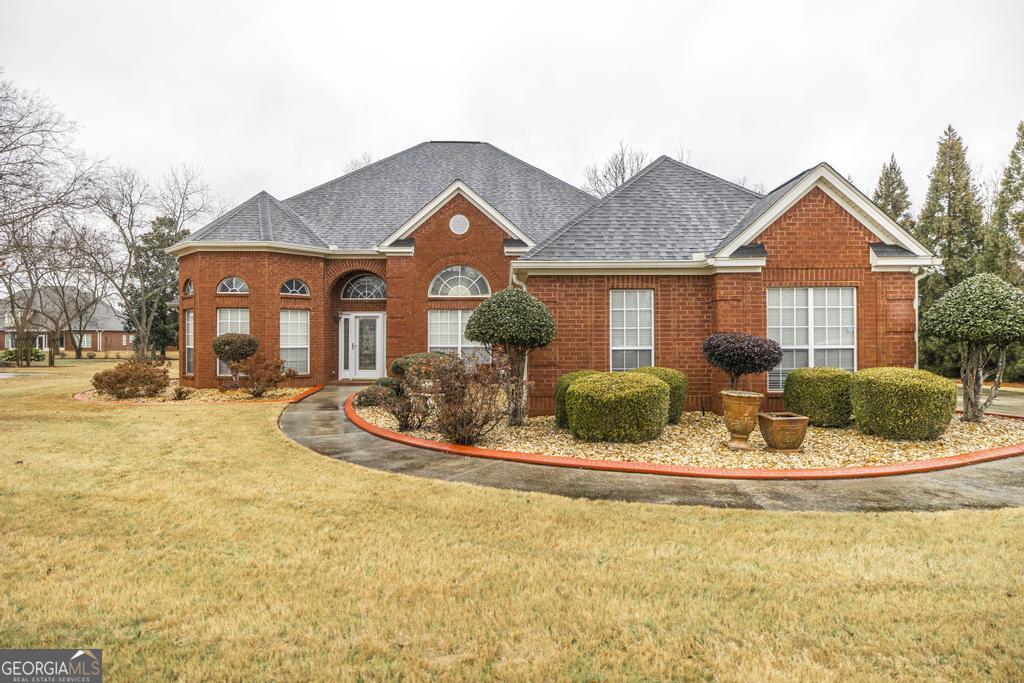 209 Trellis Walk Centerville, GA 31028 - Photo 1 of 38 a front view of a house with a yard