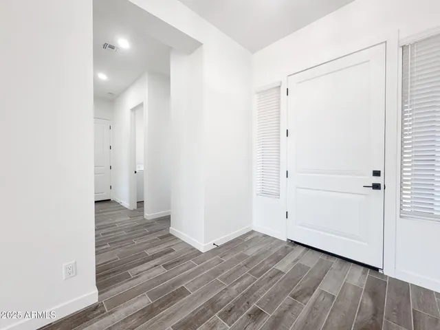 a bathroom with a double vanity sink and mirror