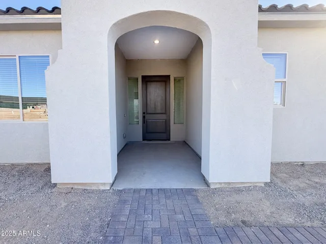 a large kitchen with kitchen island a sink stainless steel appliances and cabinets