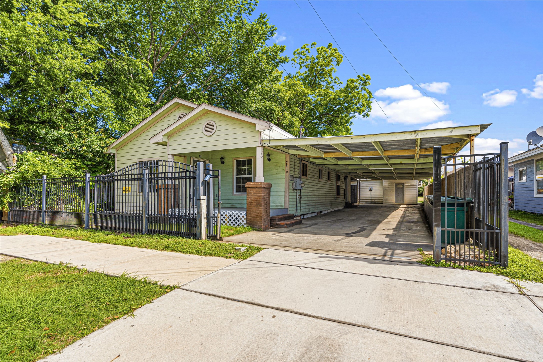 7839 Goode Street, Unit B Houston, TX 77012 - Photo 10 of 11 a view of a small house in front of a brick house with large windows