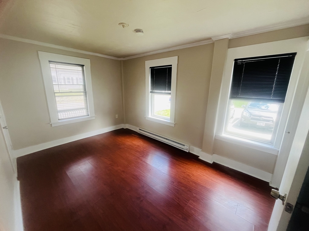 347 Main Street, Unit 2 Douglas, MA 01516 - Photo 5 of 5 a view of empty room with wooden floor and fan
