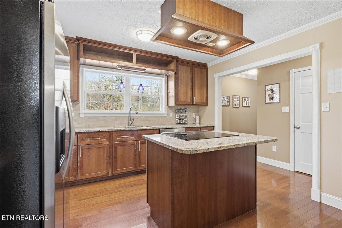 105 Carl Terry Road Wartburg, TN 37887 - Photo 15 of 55 a kitchen with stainless steel appliances granite countertop a sink stove and a refrigerator