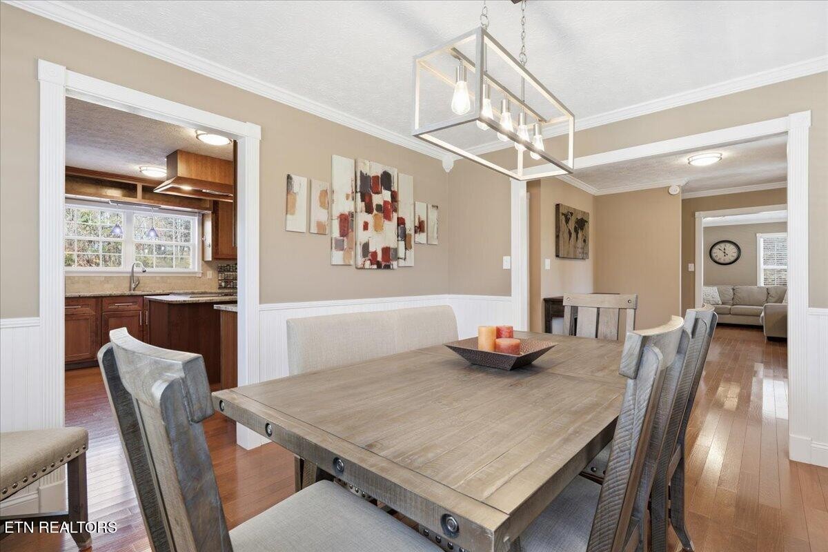 105 Carl Terry Road Wartburg, TN 37887 - Photo 21 of 55 a view of a dining room with furniture a chandelier and wooden floor