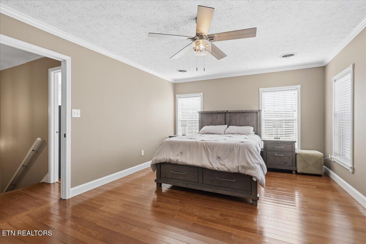 105 Carl Terry Road Wartburg, TN 37887 - Photo 25 of 55 a bedroom with a bed and wooden floor