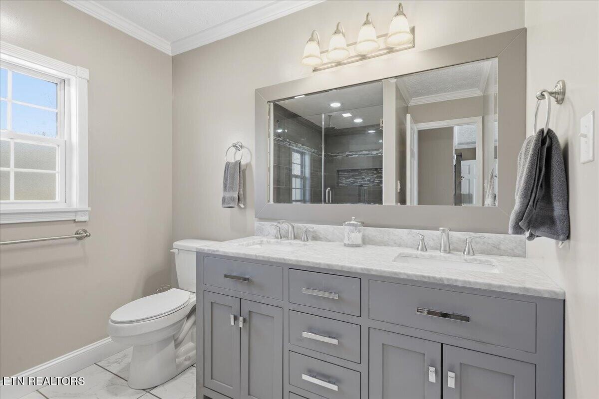 105 Carl Terry Road Wartburg, TN 37887 - Photo 26 of 55 a bathroom with a toilet sink and mirror