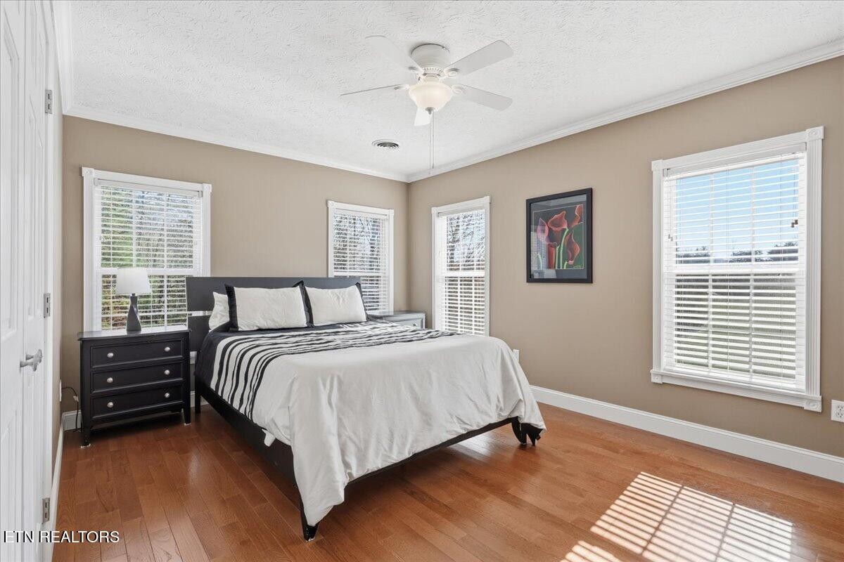 105 Carl Terry Road Wartburg, TN 37887 - Photo 29 of 55 a bedroom with a bed and a chandelier