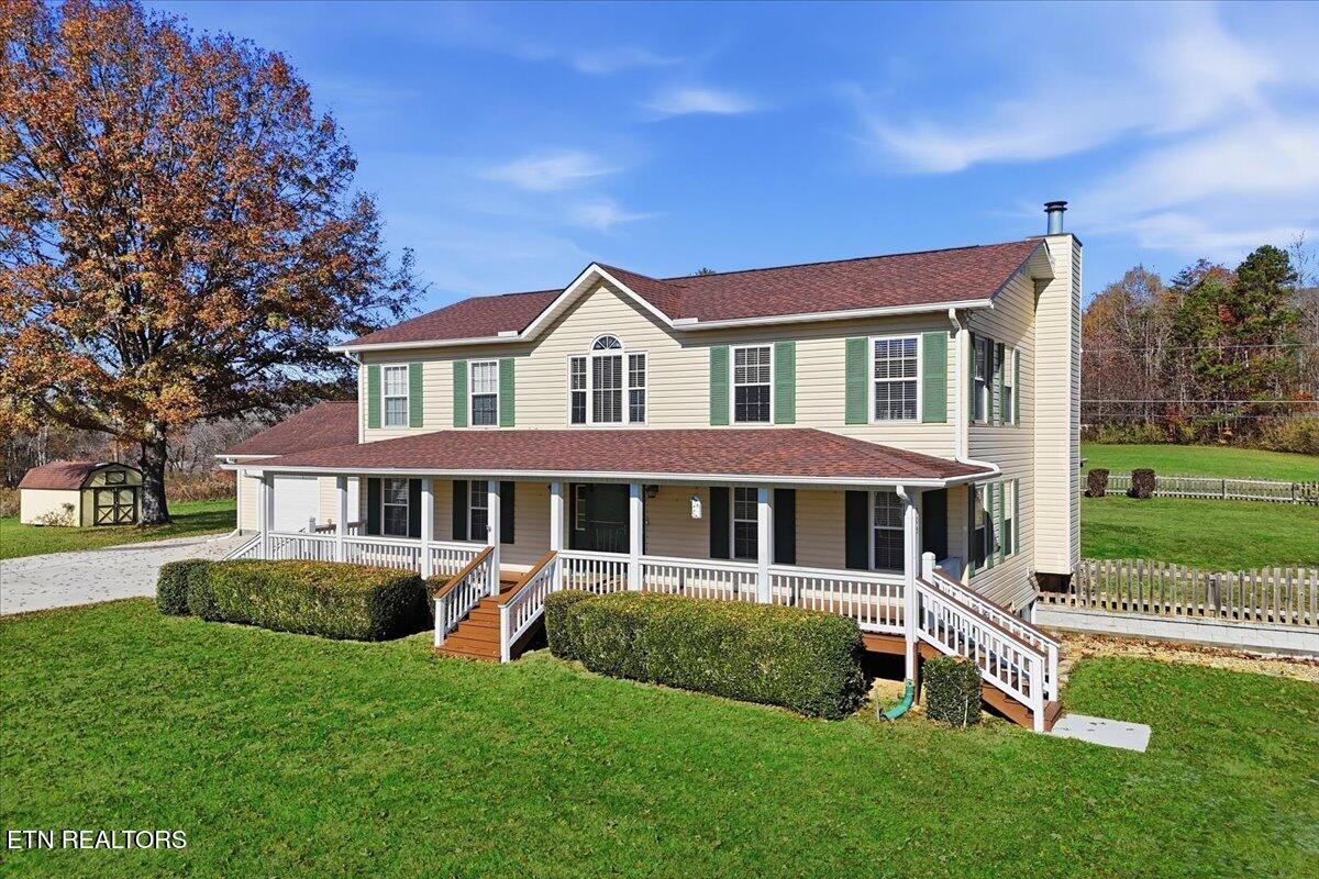 105 Carl Terry Road Wartburg, TN 37887 - Photo 3 of 55 a front view of a house with a yard table and chairs