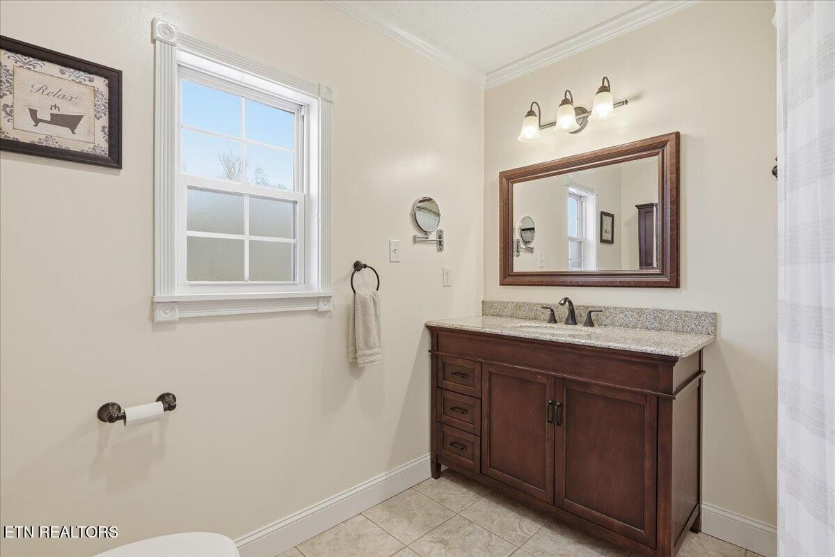 105 Carl Terry Road Wartburg, TN 37887 - Photo 31 of 55 a bathroom with a toilet sink and mirror