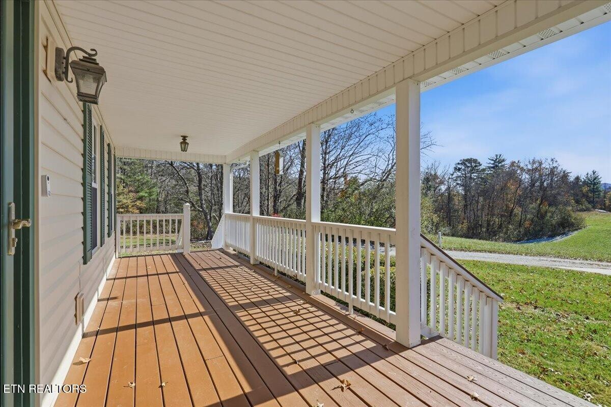 105 Carl Terry Road Wartburg, TN 37887 - Photo 5 of 55 a view of a wooden deck with a yard