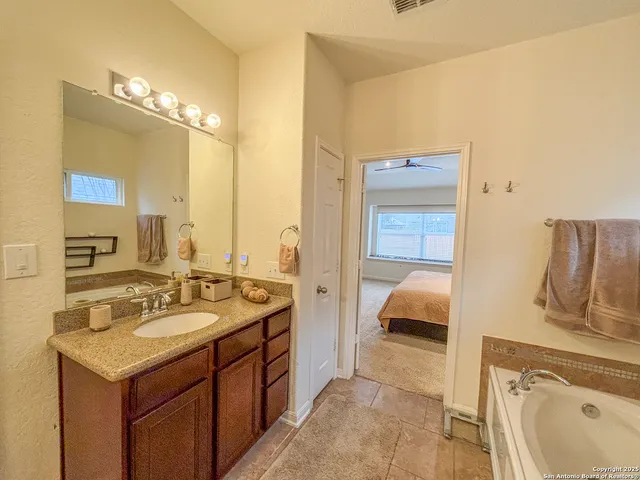 a view of a livingroom with furniture and a flat screen tv