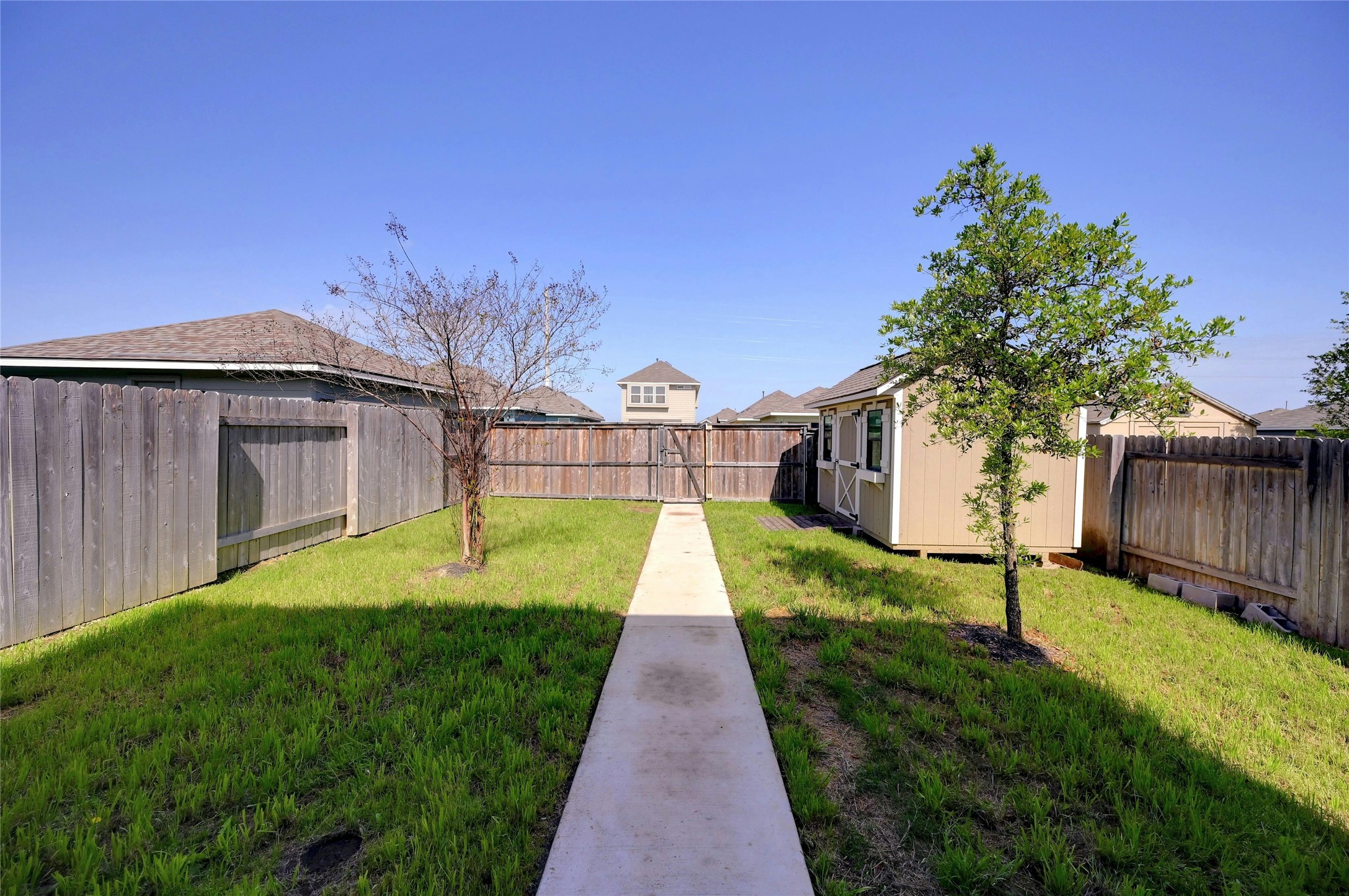 121 Switchgrass Street San Marcos, TX 78666 - Photo 28 of 33 Private garden with pathway from the backdoor to the garden gate.
