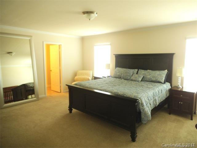 1006 Green Terra Road Indian Trail, NC 28079 - Photo 8 of 11 a bedroom with a bed and a couch