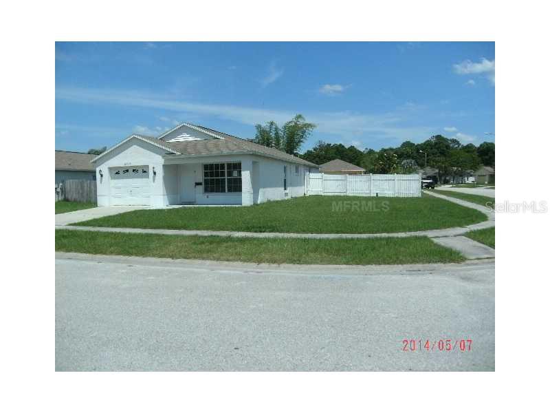 22122 Breaker Point Lane Land O' Lakes, FL 34639 - Photo 1 of 1 a picture of a big room with a big yard and potted plants