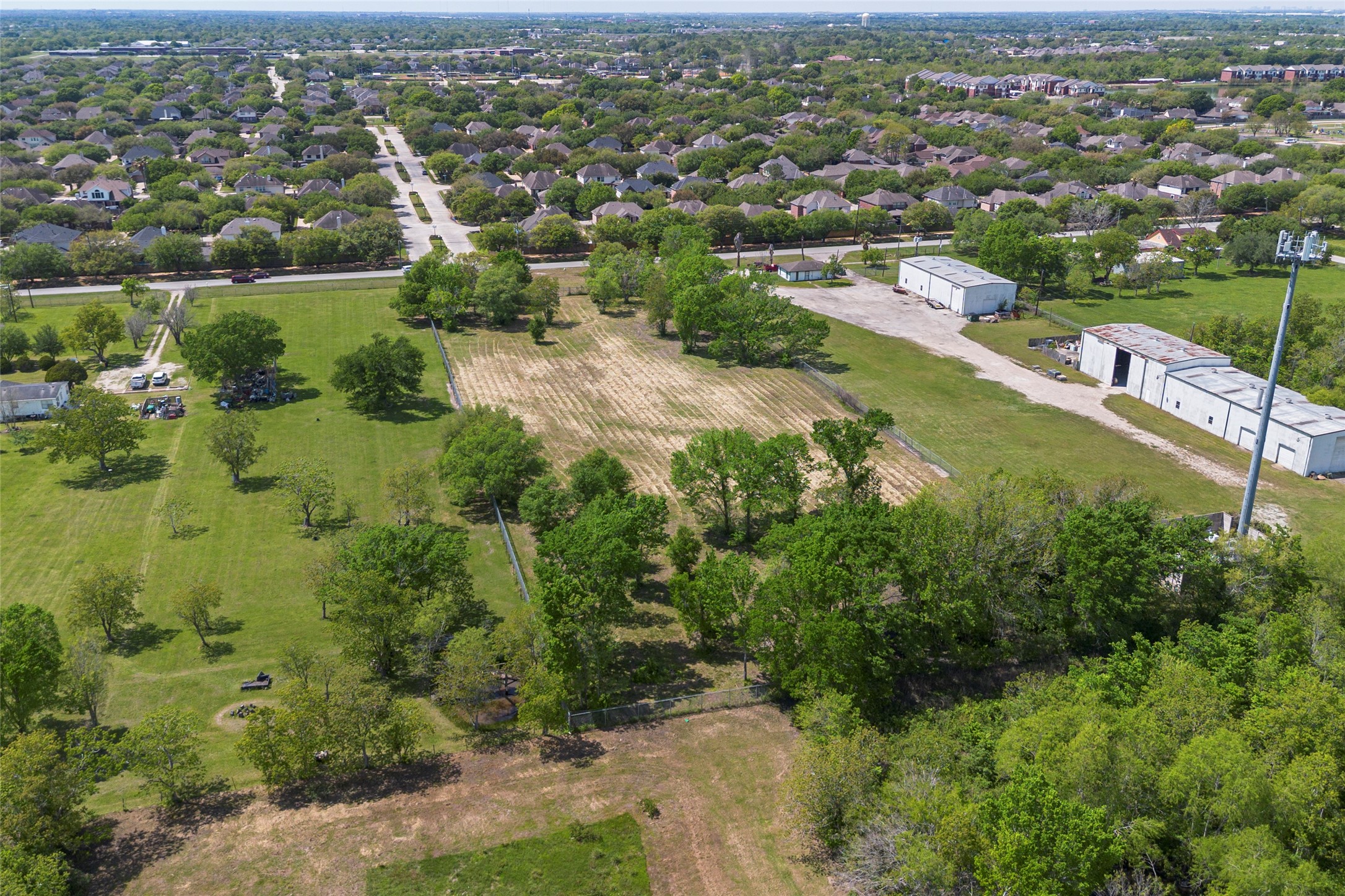0 Harkey Road Pearland, TX 77584 - Photo 3 of 5 an aerial view of city lake and residential houses with outdoor space