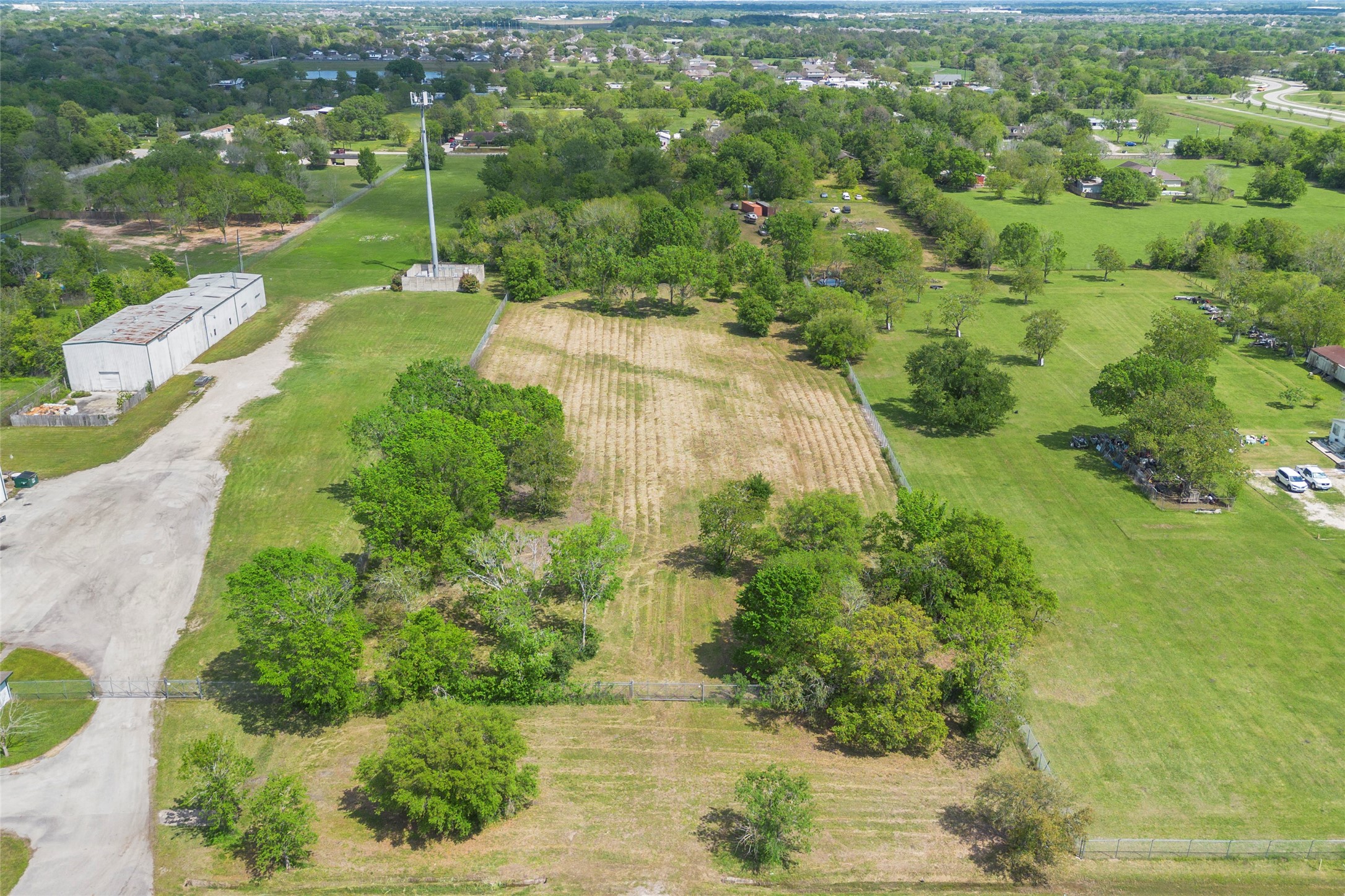 0 Harkey Road Pearland, TX 77584 - Photo 5 of 5 a view of a street with a yard
