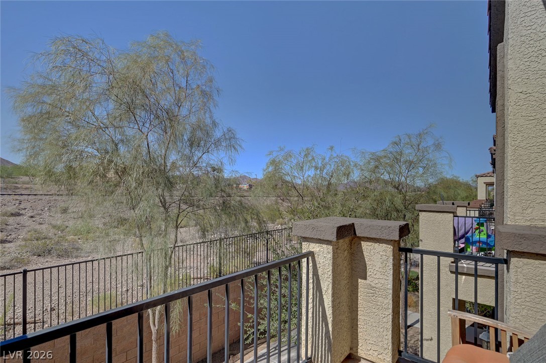 1285 Raritan Place Henderson, NV 89002 - Photo 7 of 20 Step onto the private balcony to enjoy desert mountain vistas and clear blue skies.