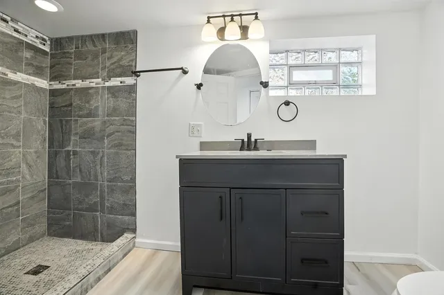 a bathroom with a sink and a mirror
