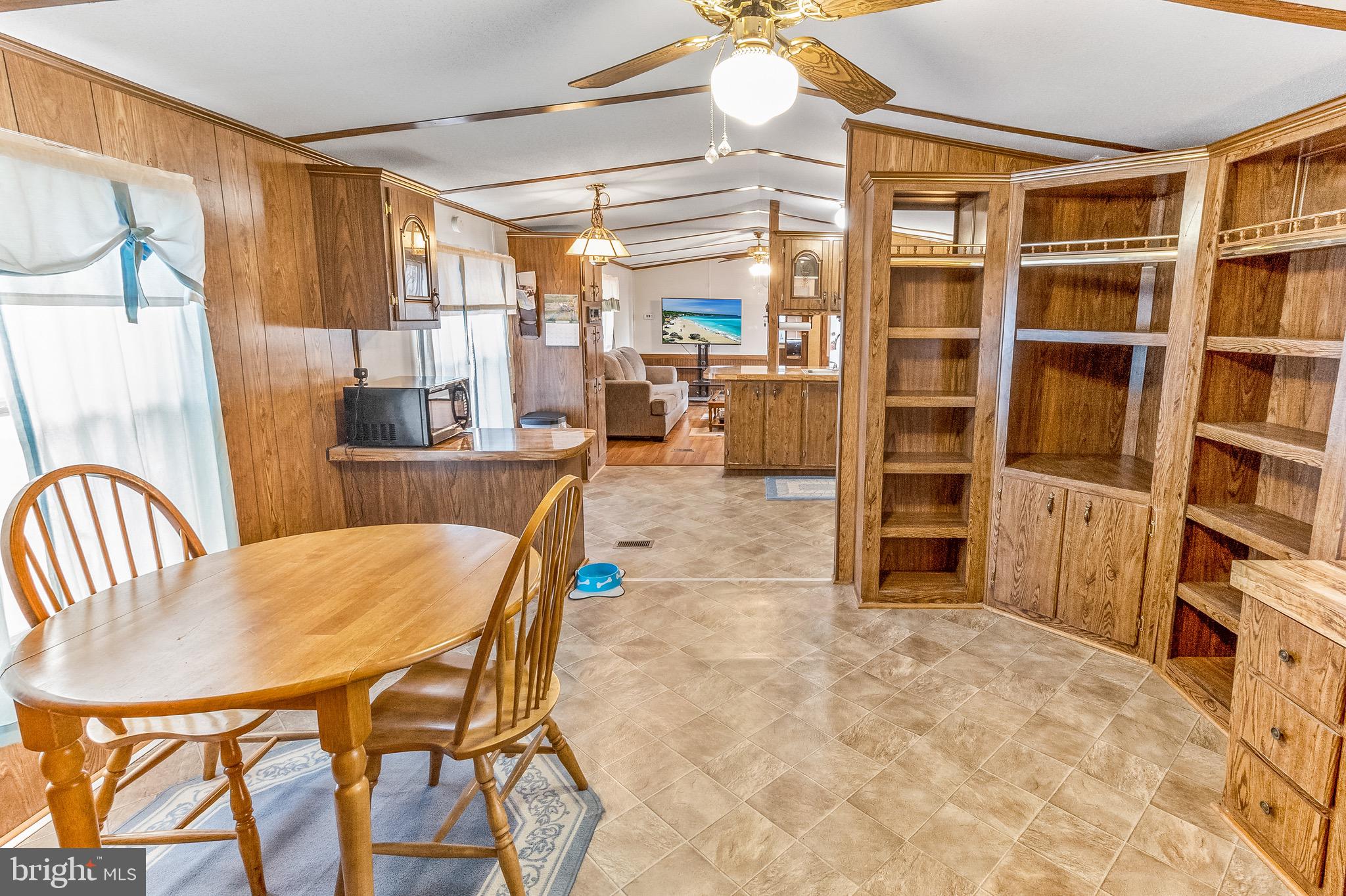 87 Explorer Lane Martinsburg, WV 25404 - Photo 12 of 27 a dining room with furniture and a book shelf