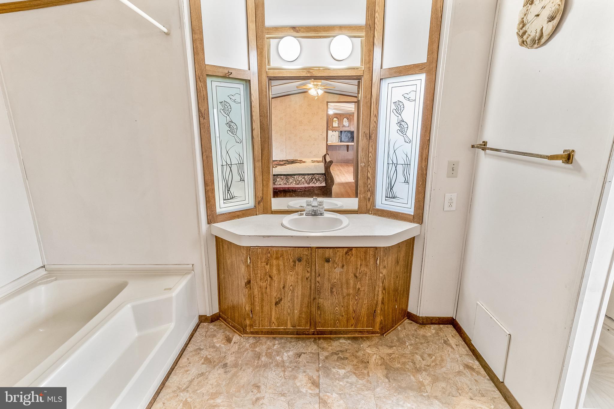 87 Explorer Lane Martinsburg, WV 25404 - Photo 17 of 27 a bathroom with a tub a sink and a window