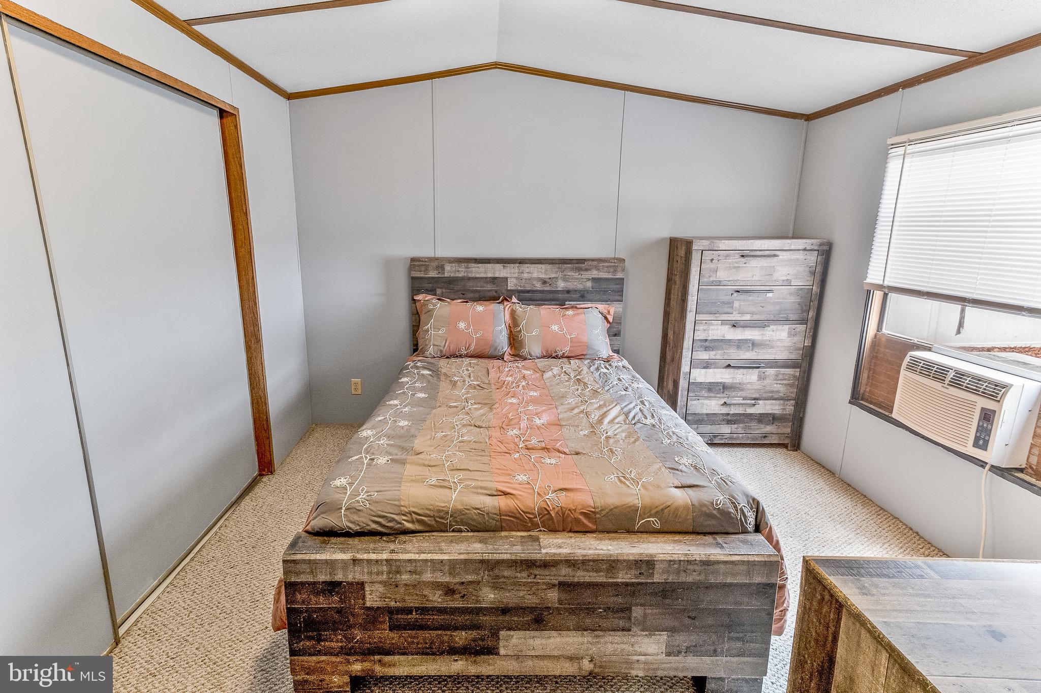 87 Explorer Lane Martinsburg, WV 25404 - Photo 19 of 27 a bed sitting in a bedroom next to a cabinet