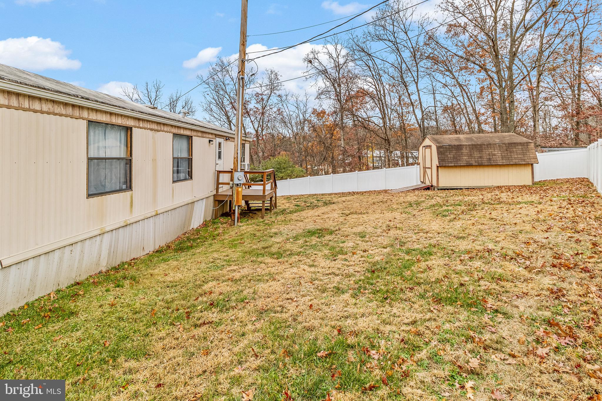 87 Explorer Lane Martinsburg, WV 25404 - Photo 23 of 27 a backyard of a house with large trees