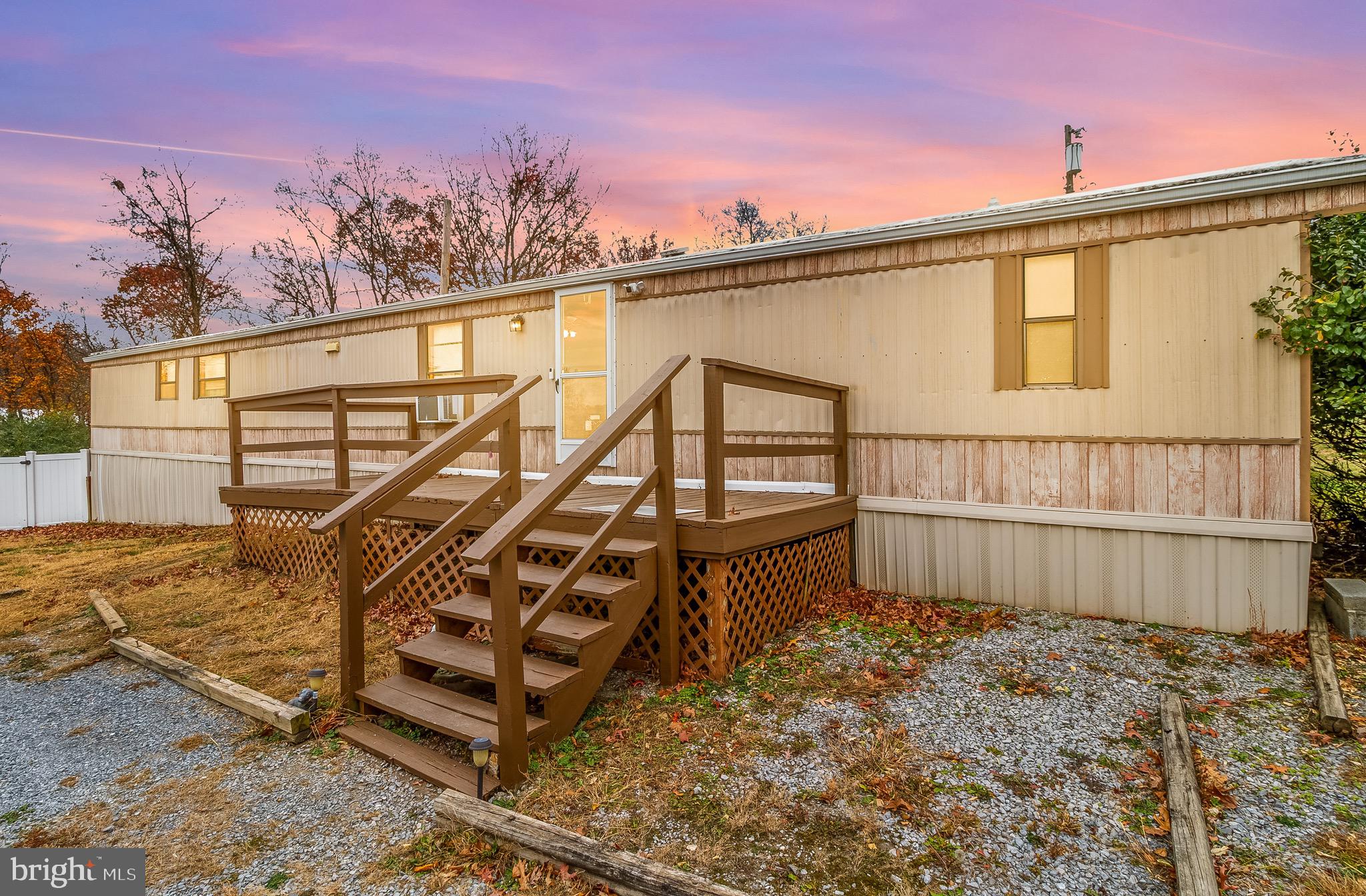87 Explorer Lane Martinsburg, WV 25404 - Photo 4 of 27 a view of a house with wooden fence and two windows