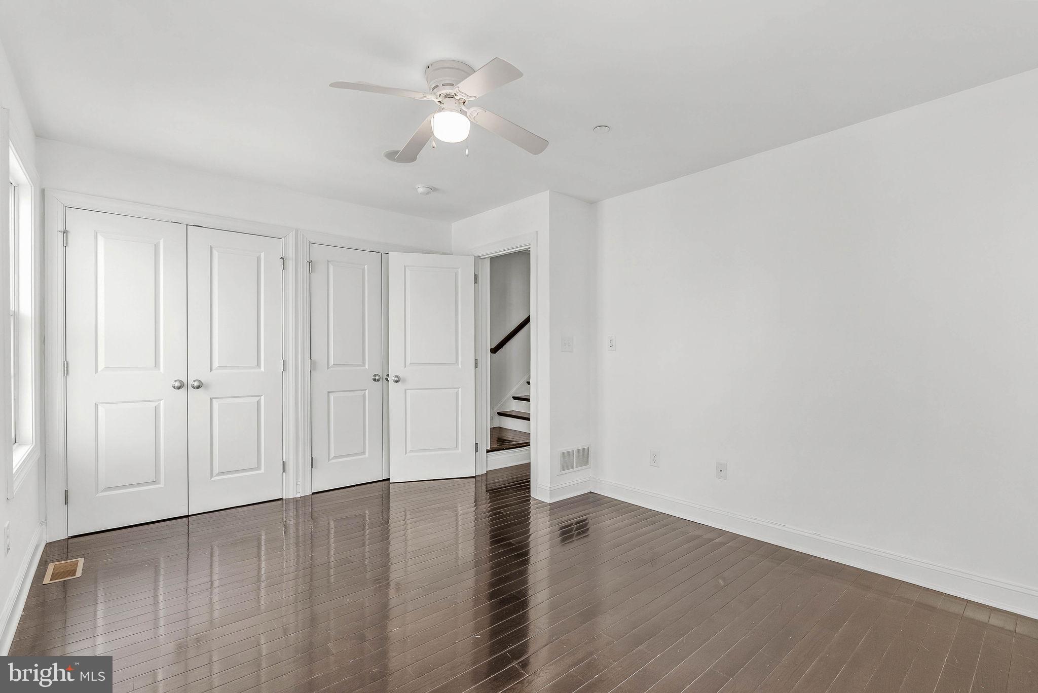 1015 North 3rd Street, Unit H Philadelphia, PA 19123 - Photo 21 of 27 a view of empty room with wooden floor and fan