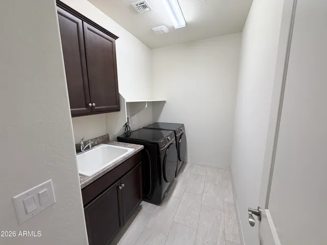 a kitchen with a sink and a stove