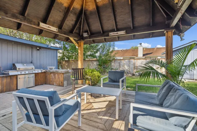 a view of a chairs and table in the patio