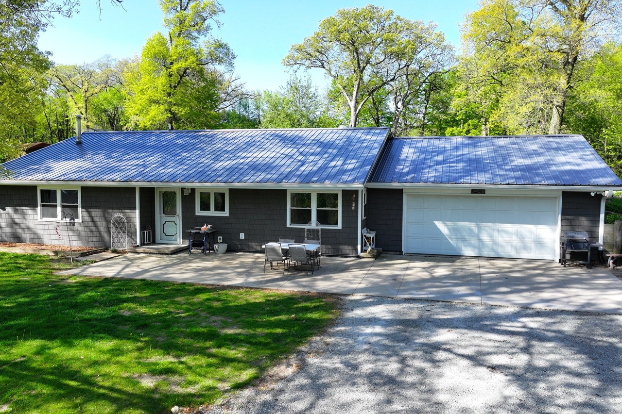 14755 Fenton Road Morrison, IL 61270 - Photo 27 of 34 a front view of a house with patio and garden