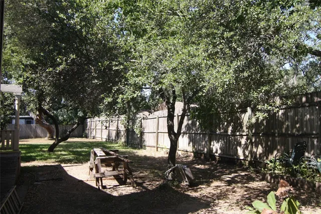 a view of outdoor space with deck and tree