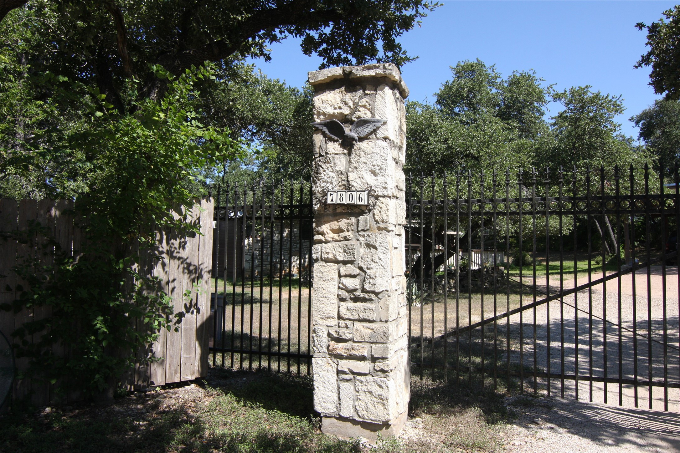 7806-7804 Indian Ridge Drive Austin, TX 78737 - Photo 2 of 40 a view of a house with a tree in front of it