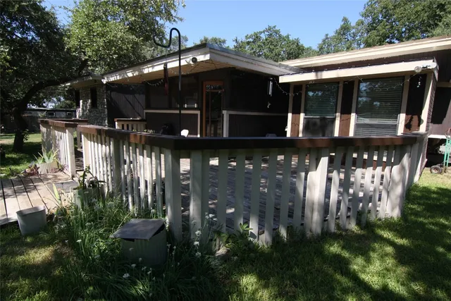 a view of empty room with wooden floor and a floor to ceiling window