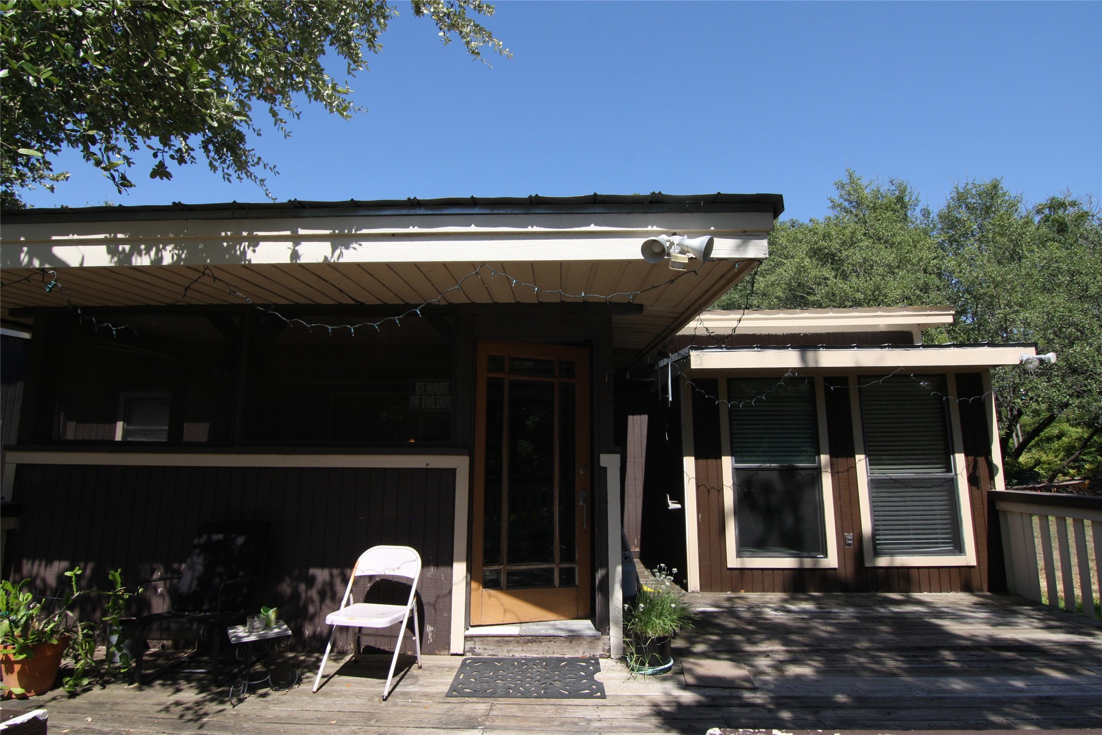 7806-7804 Indian Ridge Drive Austin, TX 78737 - Photo 25 of 40 a view of a patio with table and chairs and potted plants