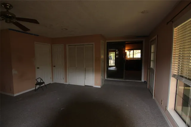 a kitchen with a sink a stove and cabinets
