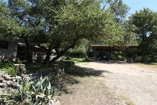 a view of backyard with green space