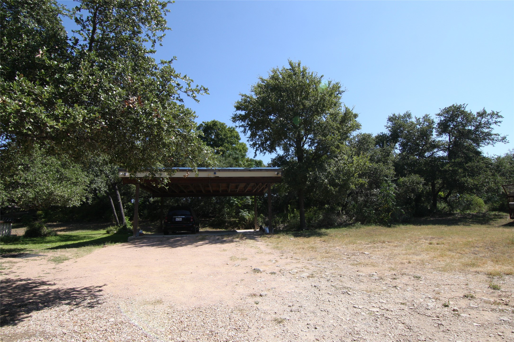 7806-7804 Indian Ridge Drive Austin, TX 78737 - Photo 6 of 40 a view of backyard with green space