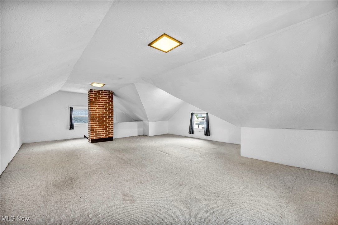 14725 Alger Road Cleveland, OH 44111 - Photo 27 of 40 Bonus room with a textured ceiling, carpet, and lofted ceiling