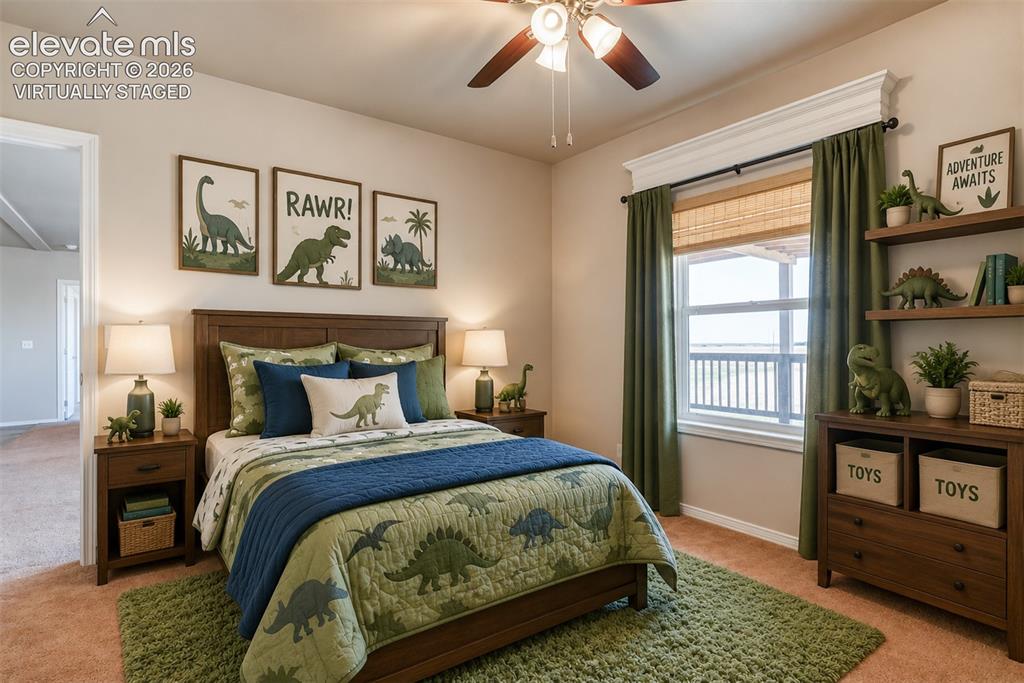 22558 Enoch Road Calhan, CO 80808 - Photo 17 of 50 a bedroom with a large bed and a window
