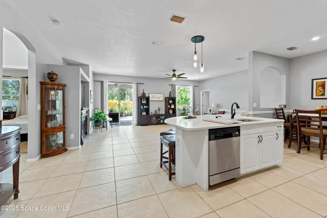 a kitchen with a sink and counter top