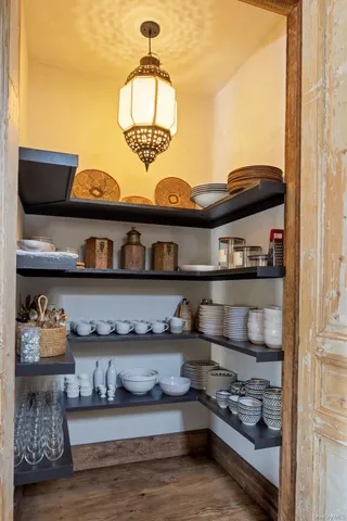 a kitchen with a stove and cabinets