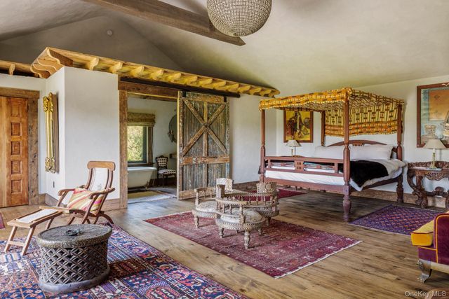a living room with furniture and a rug