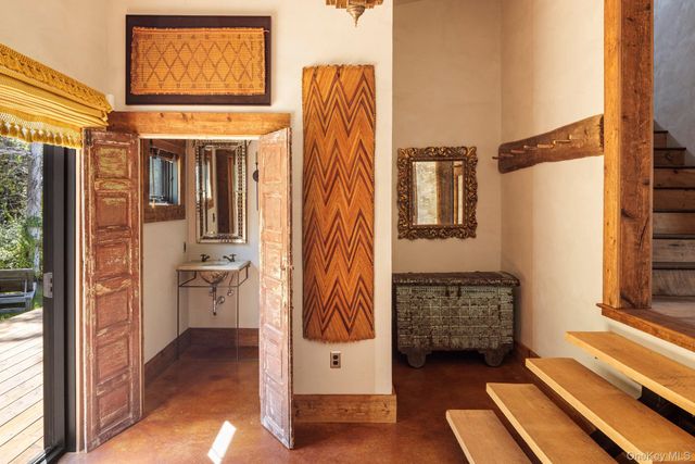 a view of front door with wooden floor