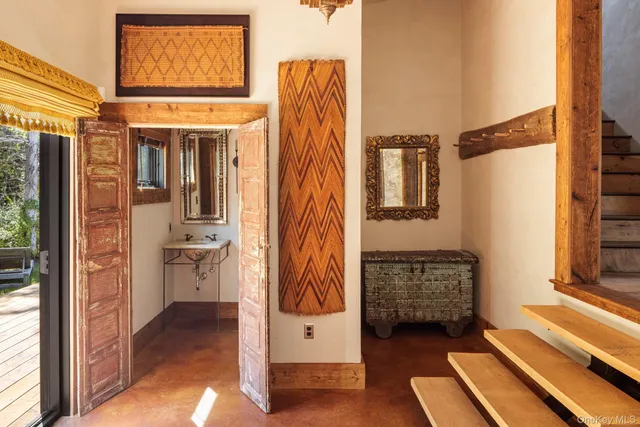 a view of front door with wooden floor