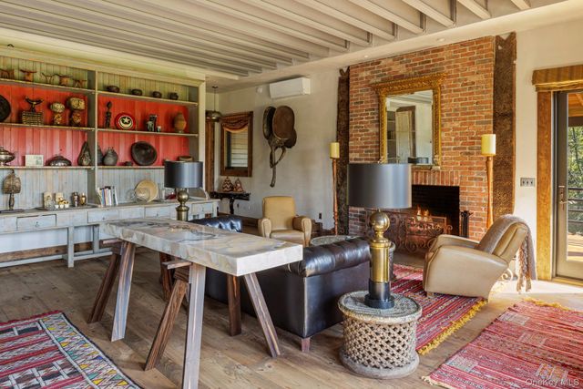 a living room with furniture and a rug