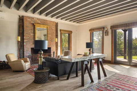 a view of a livingroom with furniture and window