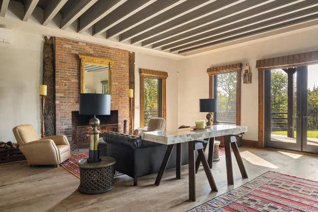 a view of a livingroom with furniture and window