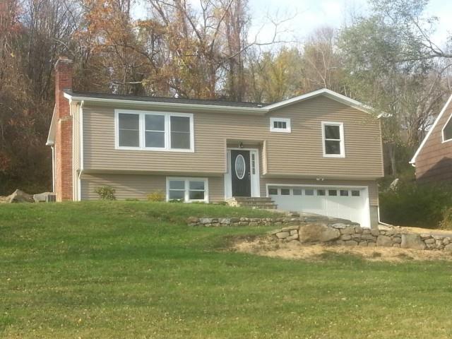 21 Mendes Road Danbury, CT 06811 - Photo 1 of 1 a front view of a house with garden
