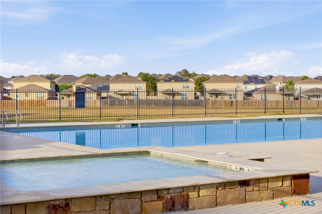 9506 Falme Lane Killeen, TX 76542 - Photo 23 of 27 a view of a swimming pool with a lake